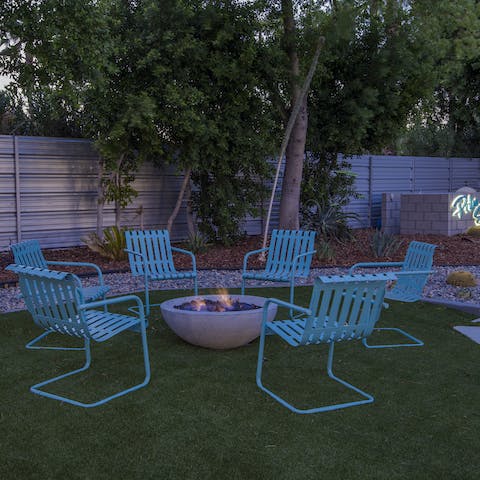 Cosy up by the fire pit after dark
