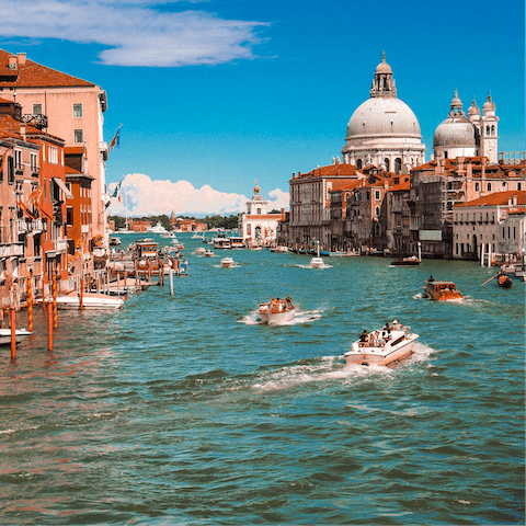 Book a water taxi through your host and explore Venice's canals