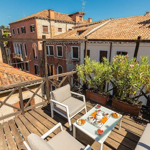 Enjoy a few Italian cocktails on the rooftop terrace