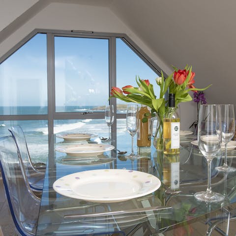 Admire the view of the sea from the dining area's huge windows
