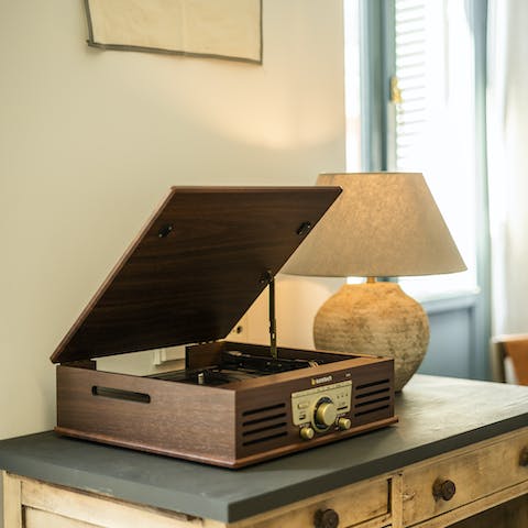 Kick back with a glass of wine as you listen to some tunes on the record player
