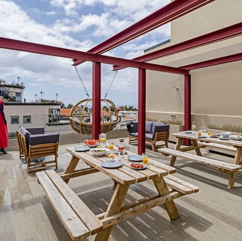Gather together on the communal roof terrace for drinks