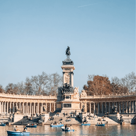 Paddle along the Great Pond of El Retiro and admire the Monument to Alfonso XII