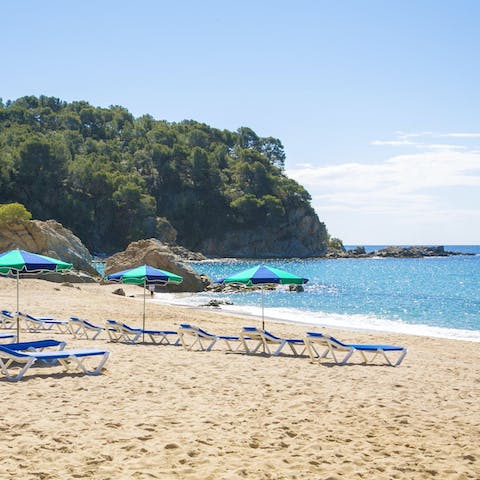 Spend the day soaking up the sunshine on Canyelles Beach