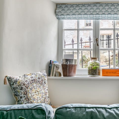 Snuggle up with a well-thumbed book in the cosy window seat