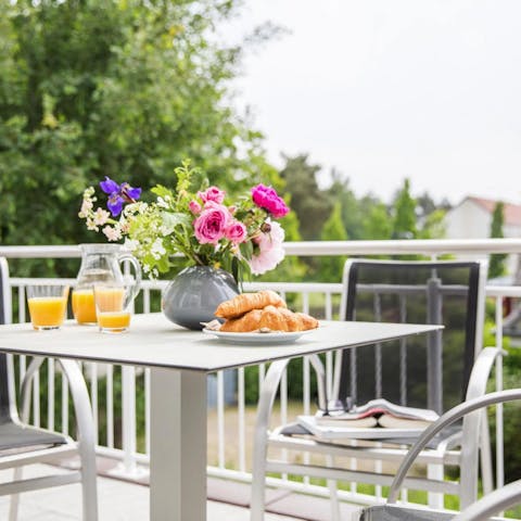 Enjoy your morning coffee and pastries outside on the balcony
