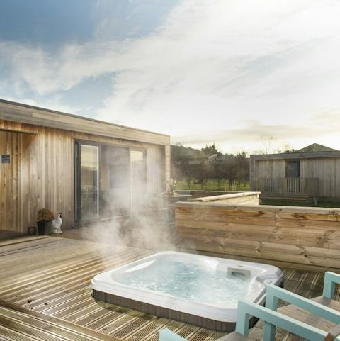 Soak away all your cares in the sunken hot tub as the stars emerge overhead