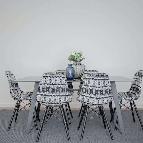 Gather for a group meal on the funky dining chairs