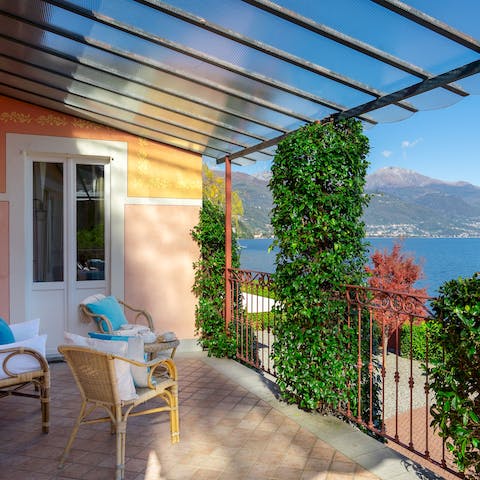 Step out onto the private balcony and look out over the calm waters of the lake