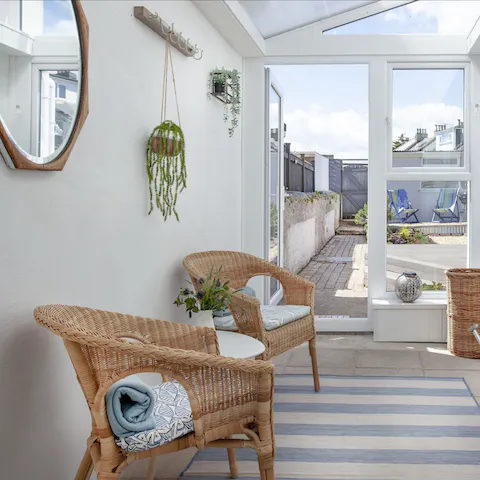Enjoy a moment of peace in the charming sun room