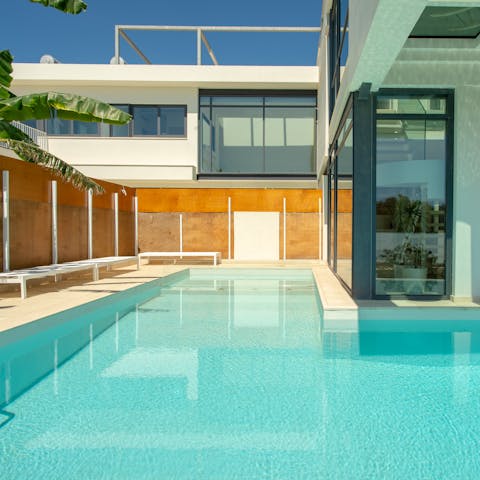 Swim laps in the glorious L-shaped swimming pool