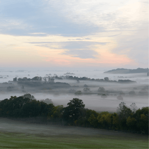 Follow hiking trails through the Cotswold countryside 
