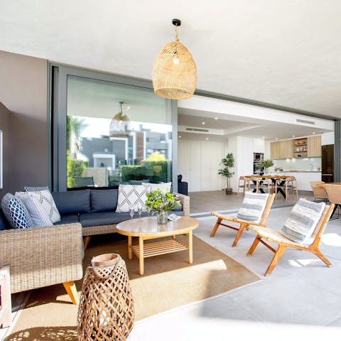 Relax with a good book and a glass of wine on the covered terrace