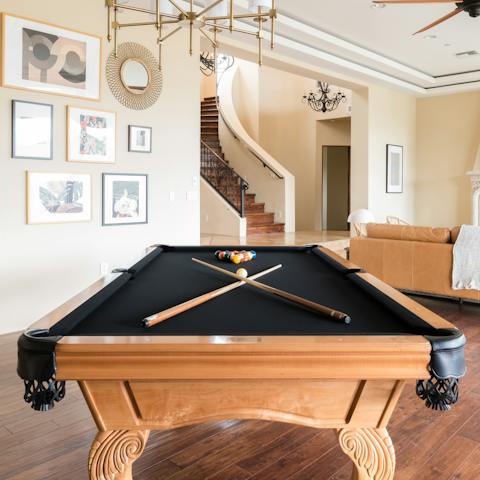 Perfect your game at the pool table in the living area