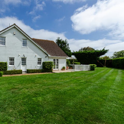 Sunbathe or enjoy a picnic on the well-kept lawn