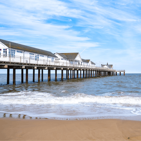 Watch the sun set over the Suffolk Coast from Southwold Pier, a ten-minute walk away
