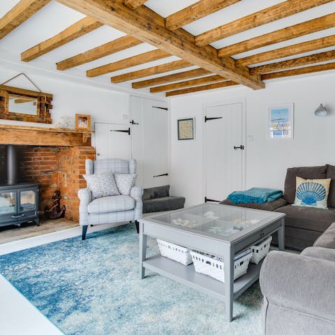 Curl up on the armchair in front of the roaring wood-burning fire