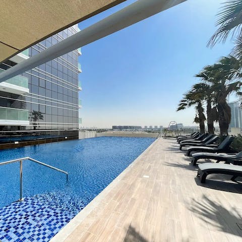 Soak up the Dubai sun from in or beside the communal pool