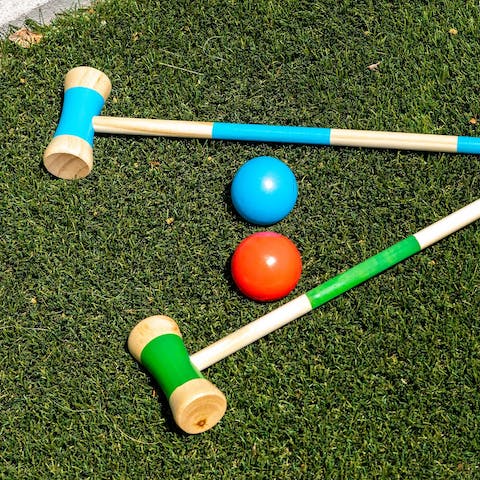 Challenge friends to a game of croquet on the lawn