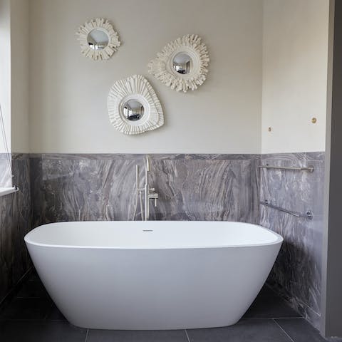 Take a bubble bath in the luxurious freestanding tub