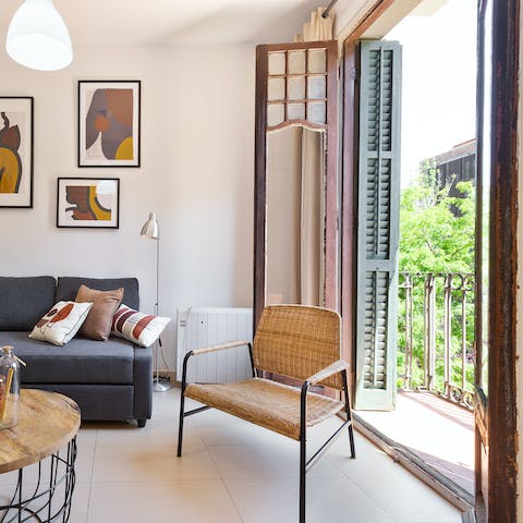 Step out onto the living room's balcony with your morning coffee
