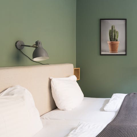 Snuggle up in the cosy bedrooms, decked out in different shades of green