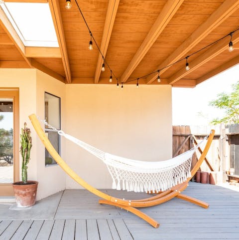 Lounge on the boho-chic hammock in the shade of the porch