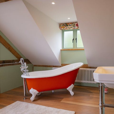 Soak sore muscles in the main bedroom's claw-footed tub