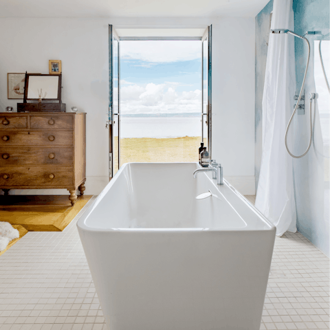 Unwind as you're soaking in the tub overlooking the glorious views
