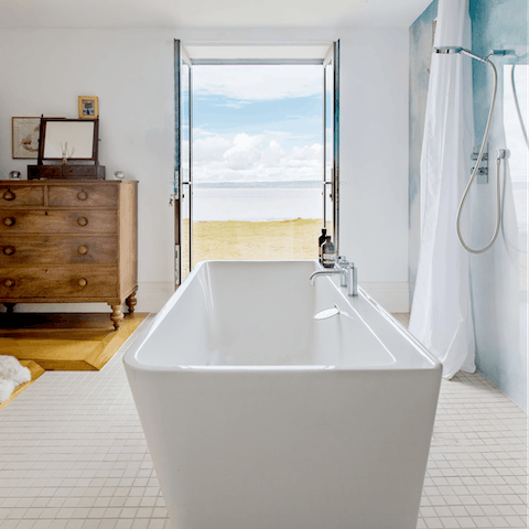 Unwind as you're soaking in the tub overlooking the glorious views