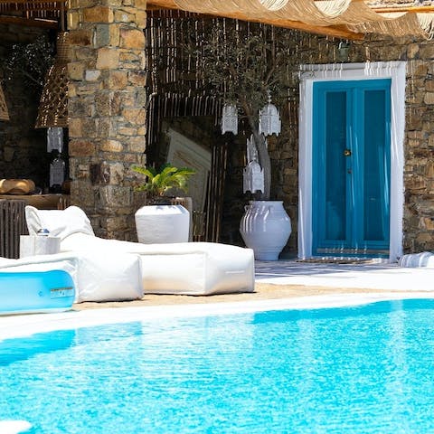 Relax by the luxurious pool and soak up the Greek sun 