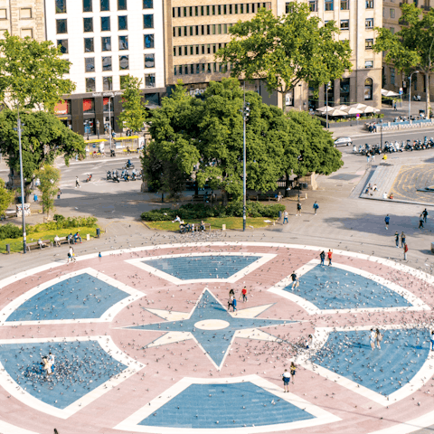 Savour morning coffees at Plaça Catalunya – just a short stroll away