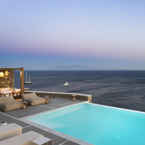 Glide gracefully through the infinity pool and watch the sunset from the loungers