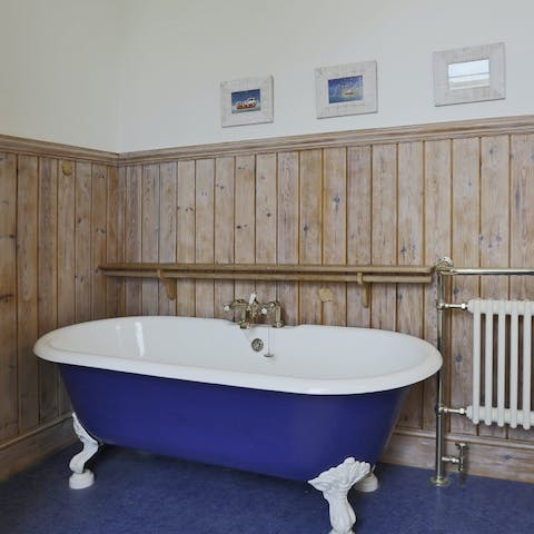 Unwind with a soak in the roll top bath tub