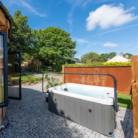 Soak up the sun or the stars as you relax in the private hot tub