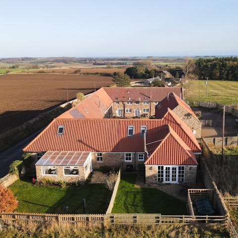 Stay in a gorgeous converted farmhouse surrounded by fields