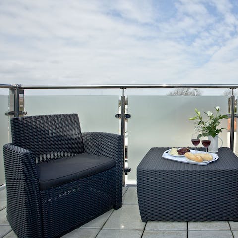 Pop open a bottle of your favourite tipple and relax on your private balcony