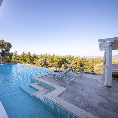 Enjoy dips in your infinity pool overlooking the luscious landscape