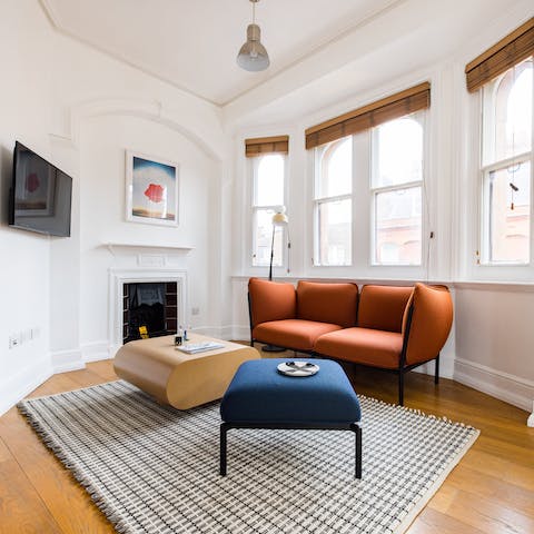 Kick back with a glass of orange wine in the contemporary living room