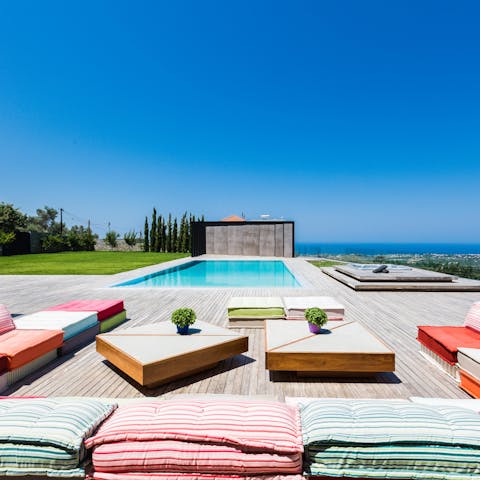 Relax on the outdoor cushions and watch the world pass by
