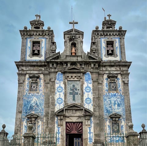 Visit the azulejo-tiled Church of Santo Ildefonso, a five-minute walk away