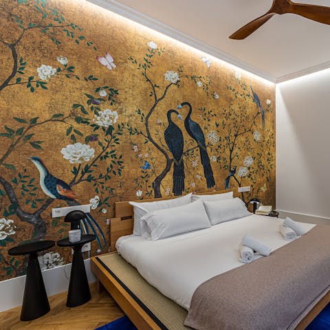 Admire the stunning wallpaper in the bedroom before you fall asleep