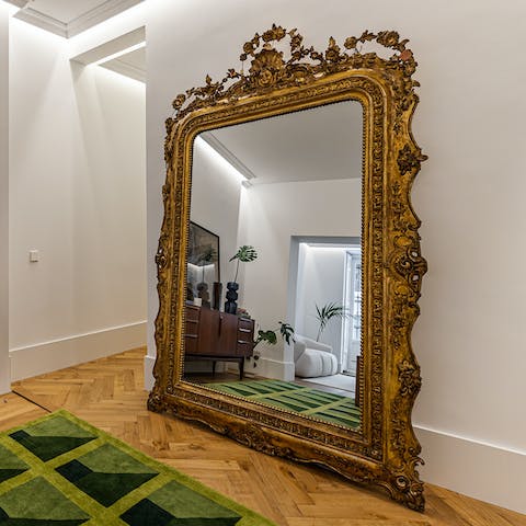 Admire your outfit of the day in the huge gilded mirror each morning