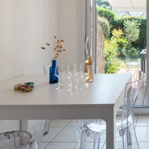 Dine in style on the ghost chairs in the bright, open-plan living space
