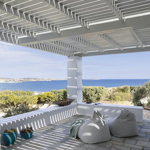 Relax under the sun-dappled pergola with your holiday read