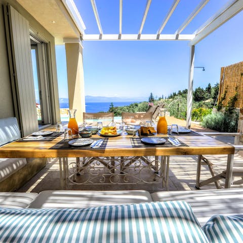 Dine in comfort on the terrace looking out to sea