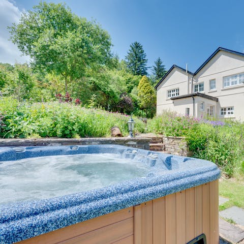 Sink into the hot tub and enjoy your surrounding landscape