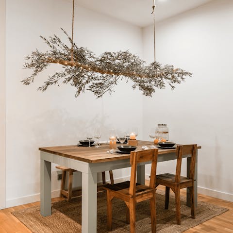 Sit down to an elegant meal beneath the olive branch feature light 