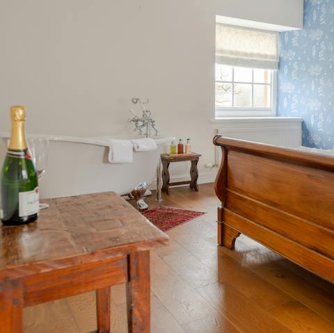 Luxuriate in the roll-top bath in the master bedroom