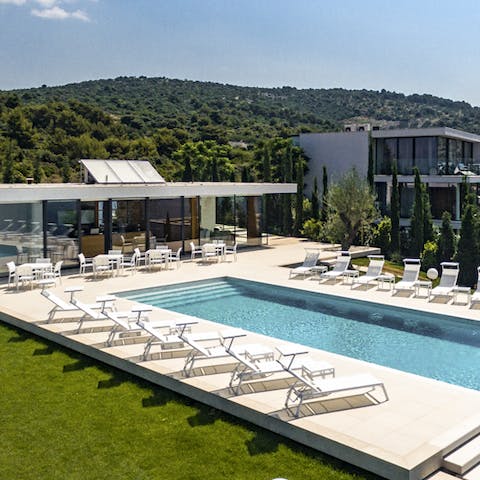 Sit back and relax in the gorgeous Croatia sun by the pool